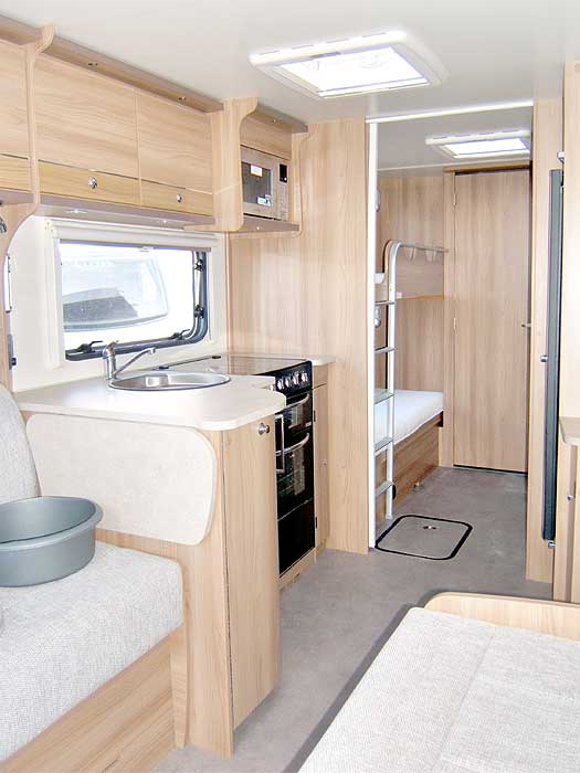A general view of the caravan interior looking through from the Front Lounge to the Rear Bedroom.